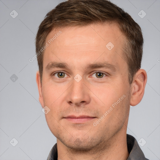 Joyful white adult male with short  brown hair and brown eyes