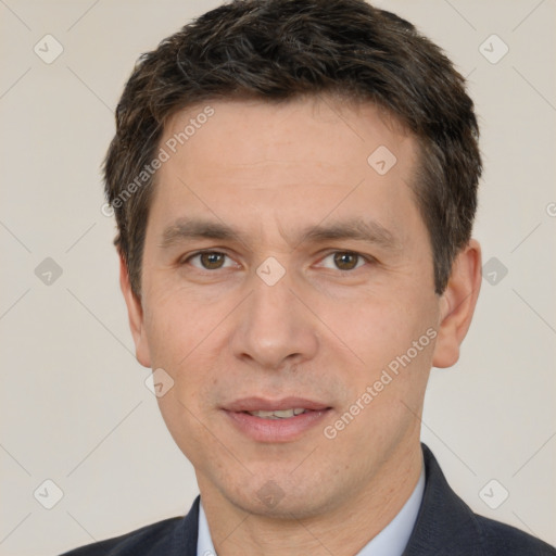 Joyful white adult male with short  brown hair and brown eyes