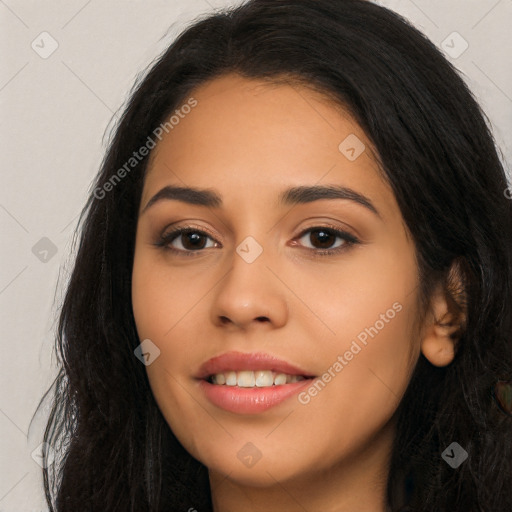 Joyful latino young-adult female with long  black hair and brown eyes