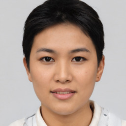 Joyful asian young-adult female with short  black hair and brown eyes