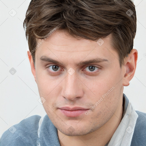 Neutral white young-adult male with short  brown hair and grey eyes