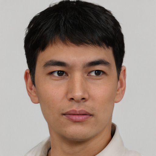 Neutral asian young-adult male with short  brown hair and brown eyes
