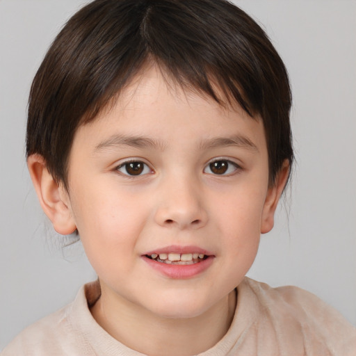 Joyful white child male with short  brown hair and brown eyes