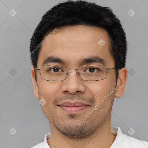 Joyful asian young-adult male with short  black hair and brown eyes