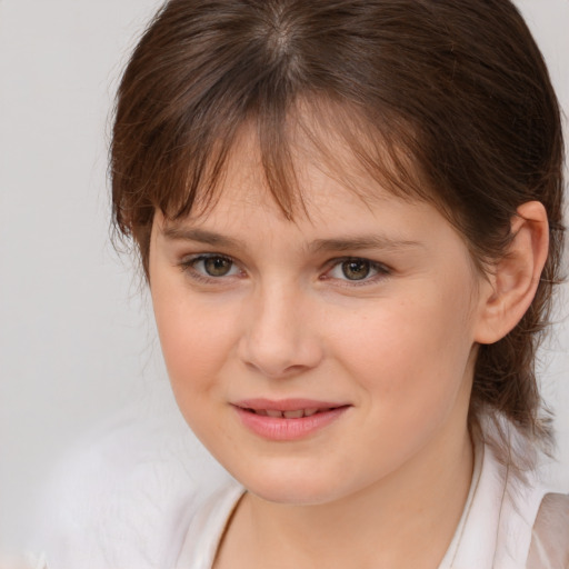 Joyful white child female with medium  brown hair and brown eyes