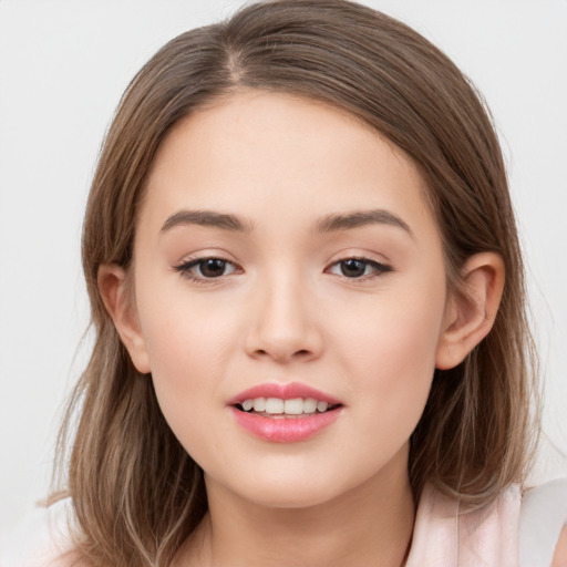 Joyful white child female with long  brown hair and brown eyes