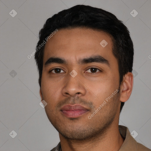 Neutral latino young-adult male with short  black hair and brown eyes