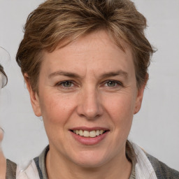 Joyful white adult female with short  brown hair and grey eyes