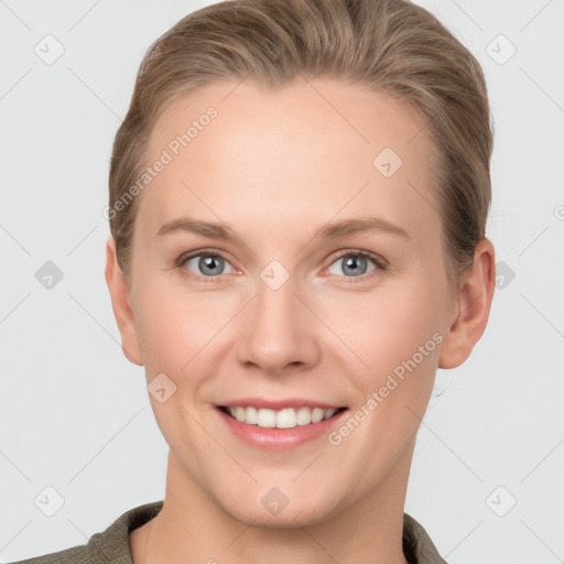 Joyful white young-adult female with short  brown hair and grey eyes