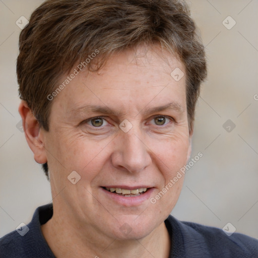 Joyful white adult male with short  brown hair and grey eyes