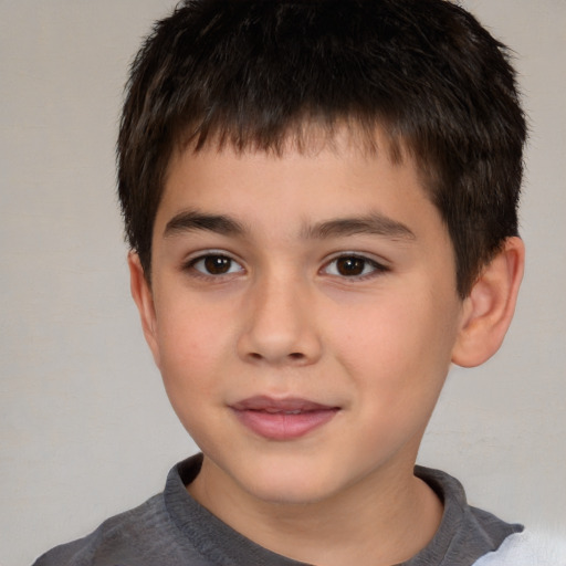 Joyful white child male with short  brown hair and brown eyes