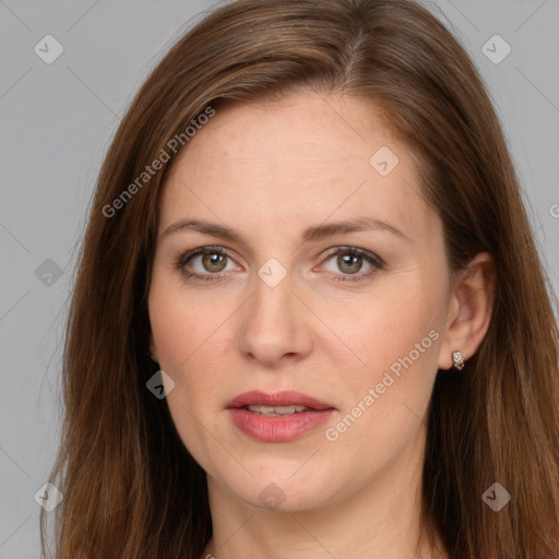 Joyful white adult female with long  brown hair and brown eyes