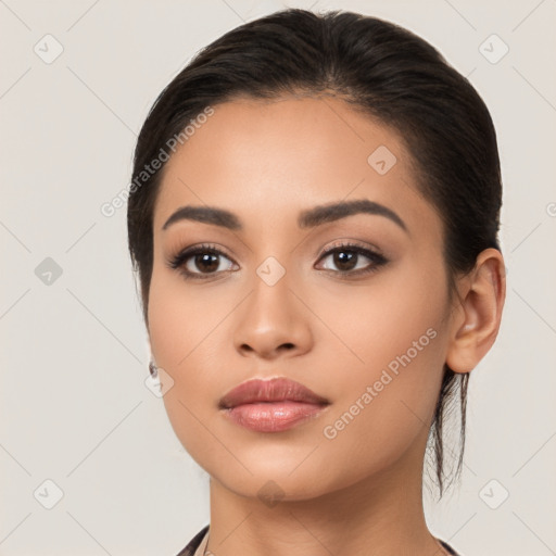 Neutral latino young-adult female with long  black hair and brown eyes