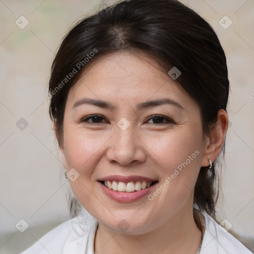 Joyful white adult female with medium  brown hair and brown eyes