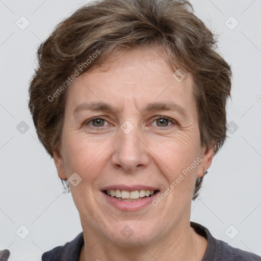 Joyful white adult female with short  brown hair and grey eyes