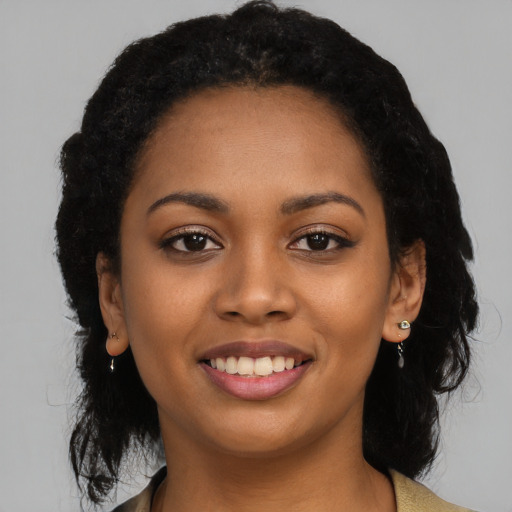 Joyful latino young-adult female with long  black hair and brown eyes