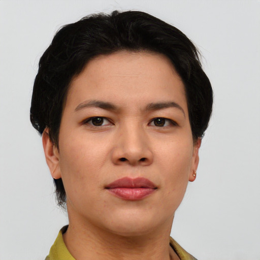 Joyful asian young-adult female with short  black hair and brown eyes