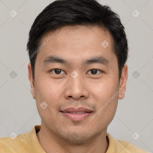 Joyful white young-adult male with short  black hair and brown eyes