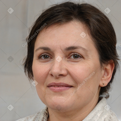 Joyful white adult female with medium  brown hair and grey eyes