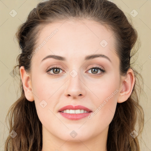 Joyful white young-adult female with long  brown hair and blue eyes