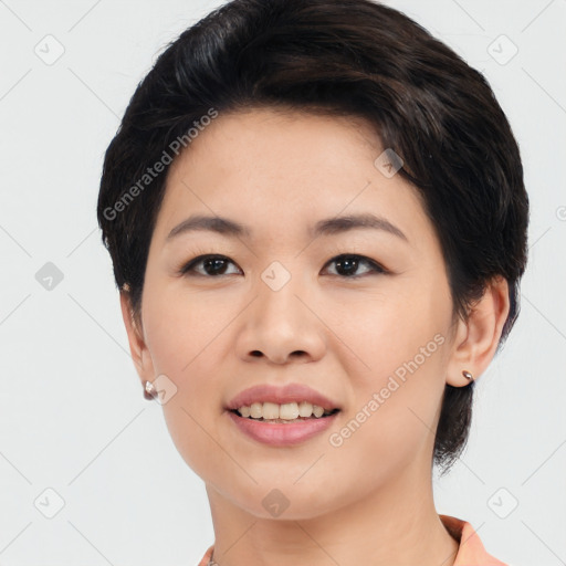 Joyful asian young-adult female with medium  black hair and brown eyes