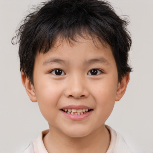 Joyful white child male with short  brown hair and brown eyes