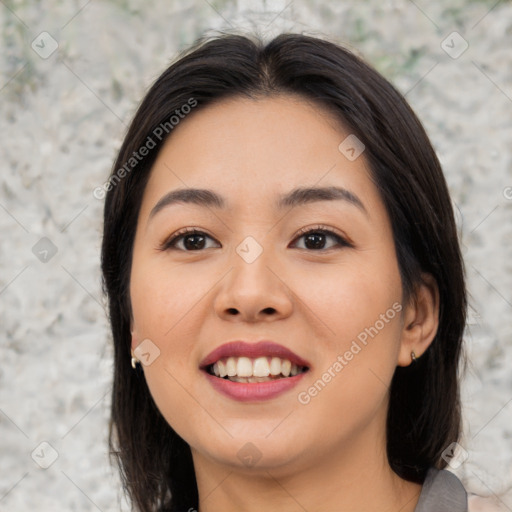 Joyful asian young-adult female with medium  black hair and brown eyes