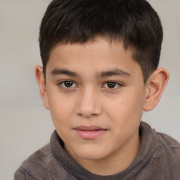 Joyful white child male with short  brown hair and brown eyes