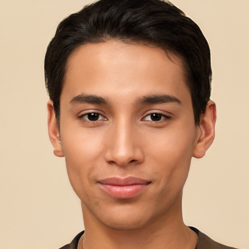 Joyful latino young-adult male with short  brown hair and brown eyes