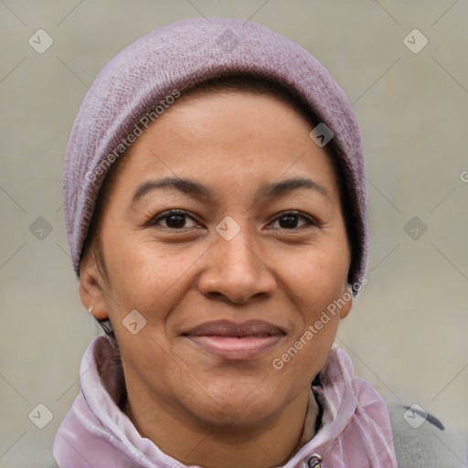 Joyful latino adult female with short  brown hair and brown eyes