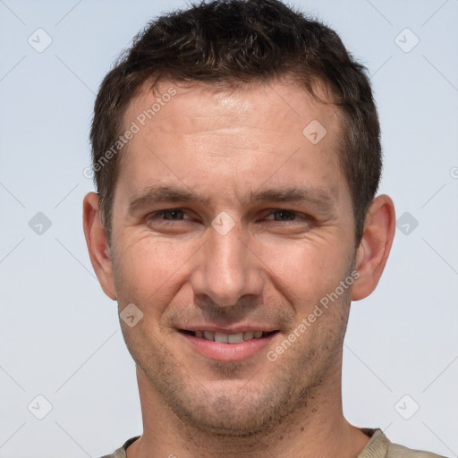 Joyful white adult male with short  brown hair and brown eyes