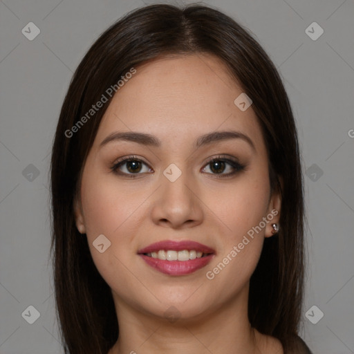 Joyful latino young-adult female with long  brown hair and brown eyes