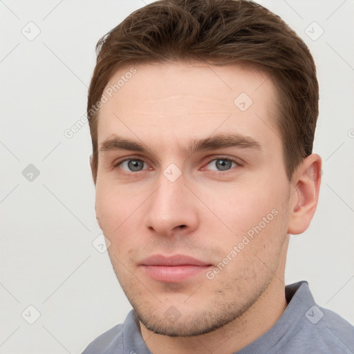 Neutral white young-adult male with short  brown hair and grey eyes