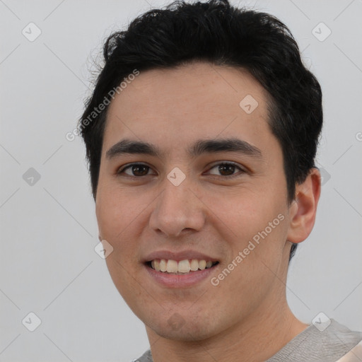 Joyful white young-adult male with short  black hair and brown eyes