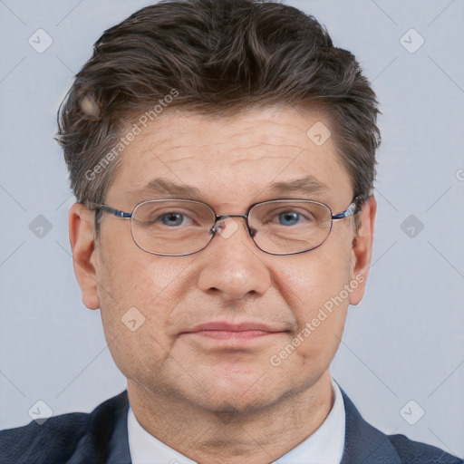 Neutral white middle-aged male with short  brown hair and brown eyes