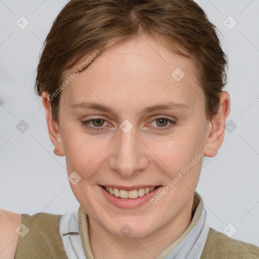 Joyful white young-adult female with short  brown hair and grey eyes