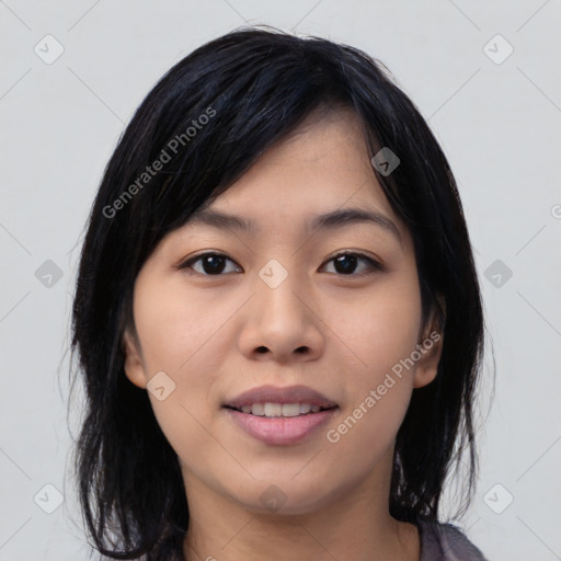 Joyful asian young-adult female with medium  black hair and brown eyes