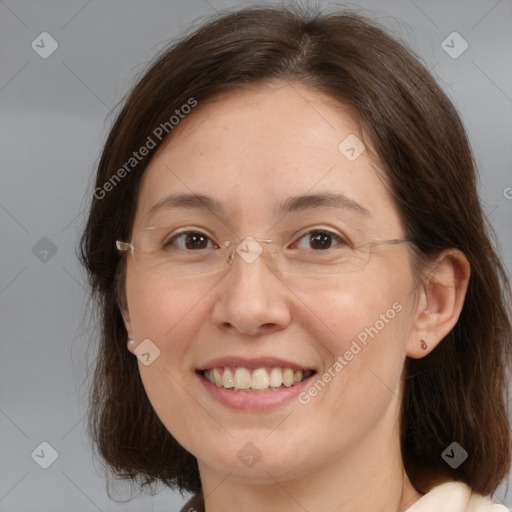 Joyful white adult female with medium  brown hair and brown eyes