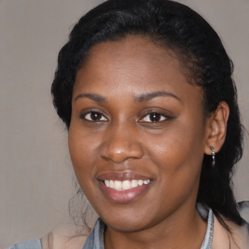 Joyful black young-adult female with medium  black hair and brown eyes