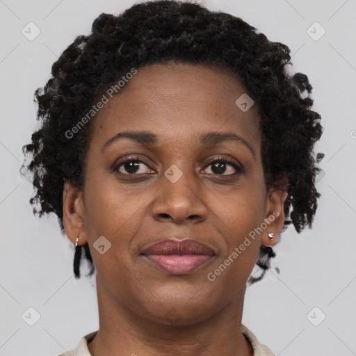 Joyful black adult female with short  brown hair and brown eyes