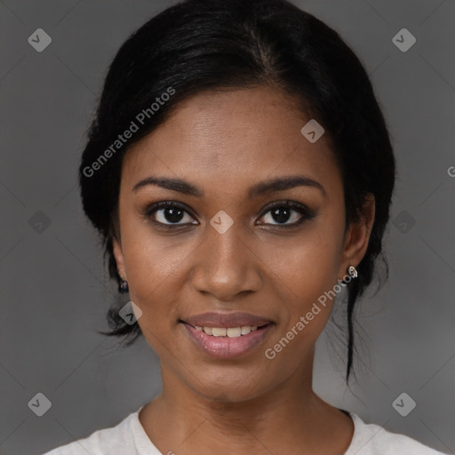 Joyful black young-adult female with medium  black hair and brown eyes