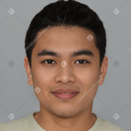 Joyful latino young-adult male with short  black hair and brown eyes