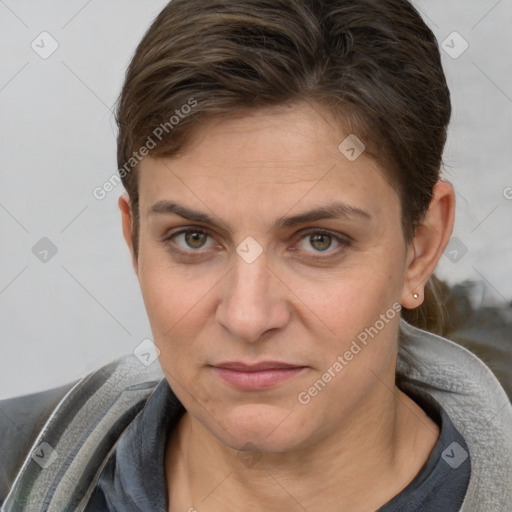 Joyful white adult female with short  brown hair and brown eyes