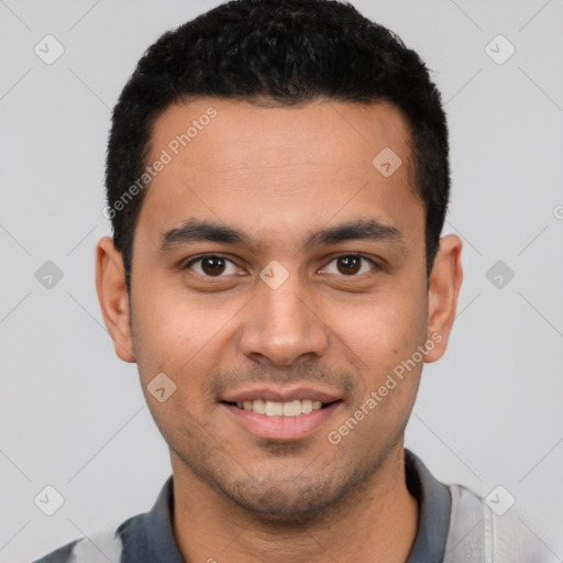 Joyful white young-adult male with short  black hair and brown eyes