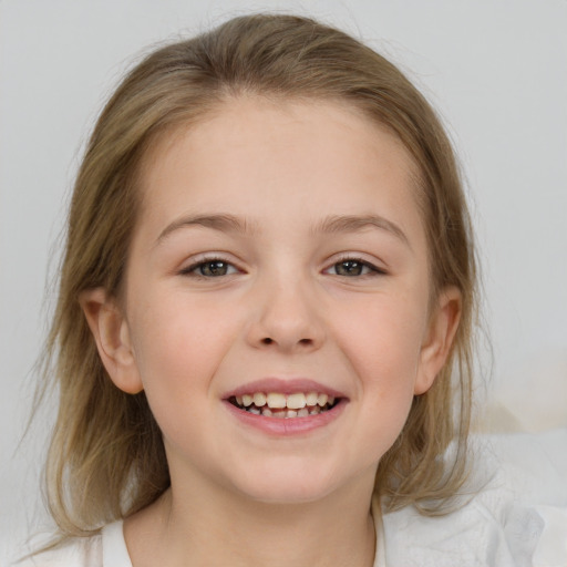 Joyful white child female with medium  brown hair and grey eyes