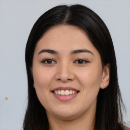 Joyful asian young-adult female with long  brown hair and brown eyes