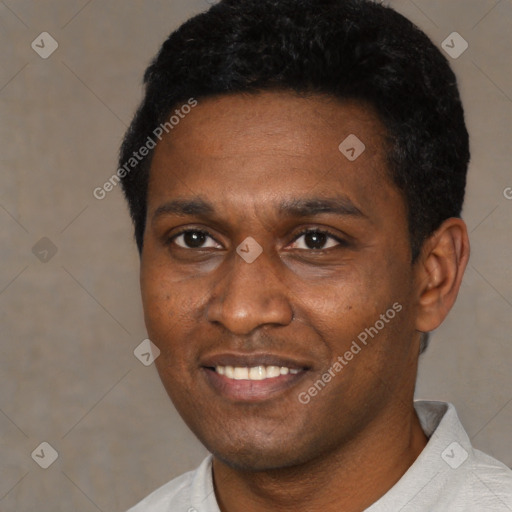 Joyful black young-adult male with short  black hair and brown eyes