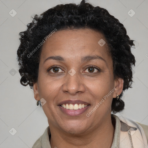 Joyful black adult female with short  brown hair and brown eyes