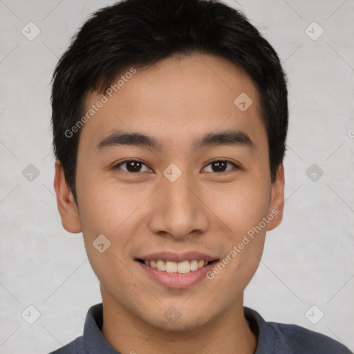 Joyful asian young-adult male with short  brown hair and brown eyes