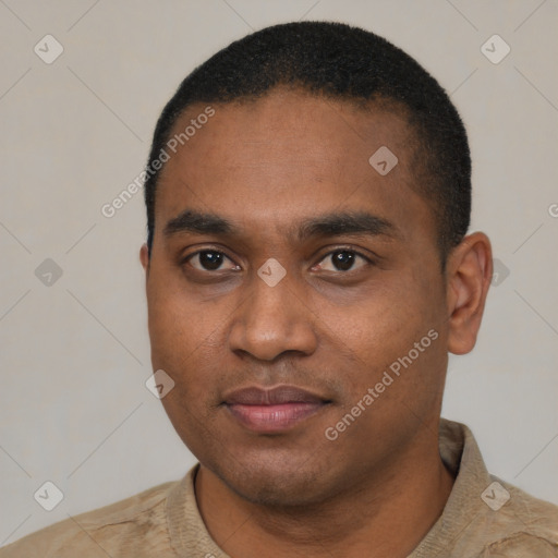 Joyful black young-adult male with short  black hair and brown eyes